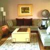 Two rooms were created in this space: one is modern and open:  Sectionals from the den were moved into the living room and placed separately,  two wicker chairs were brought in from bedroom, adding texture and a more relaxed attitude to the room,  