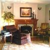 On the other side of the living room, a reading nook by the fire place, and the piano make this music room romantic and cozy.  